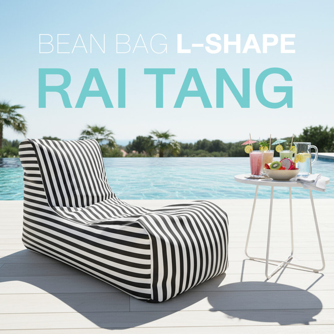 Ultra-photorealistic outdoor scene of a stylish black and white striped L-shaped bean bag placed beside a modern swimming pool. Next to the bean bag, there is a small dining table with neatly arranged tropical fruit drinks and light refreshments. The bean bag is positioned on a clean poolside deck, with shimmering turquoise water reflecting sunlight in the background. The atmosphere is bright, summery, and relaxing, with soft natural shadows cast on the ground. No other large furniture is visible — focus is on the bean bag, the small table with fruit drinks, and the poolside environment. Cinematic detail, 8K resolution, sharp focus, realistic textures.